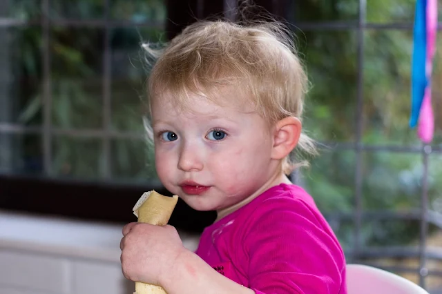 toddler eating dairy free pancakes