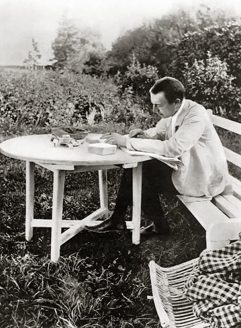 Sergei Rachmaninov at Ivanovka, proofing his third piano concerto.