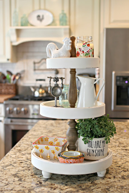 3 tiered kitchen stand from HomeGoods on kitchen island. More ideas for tiered stands in this post.