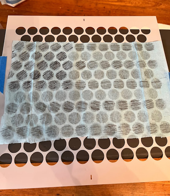 Photo of a flag pattern being used with a penny tile stencil.