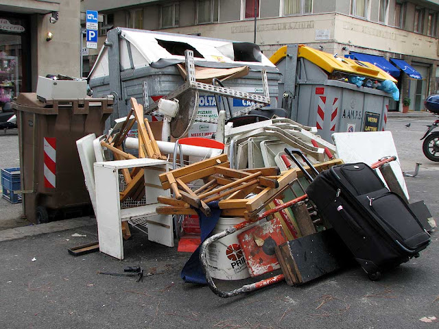 Trash around dumpsters, Livorno