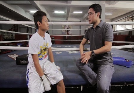 Anthony Taberna with a 15-year-old fan of Manny Pacquiao in Tapatan ni Tunying