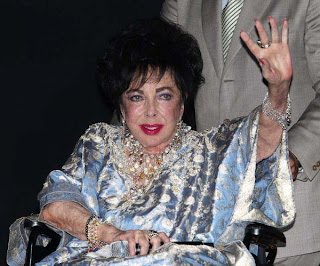 Hollywood Actress Elizabeth Taylor - Last Age at Wheel Chair in a Party 