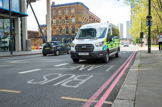 Non-emergency ambulance using the bus lane in London. Image by TfL