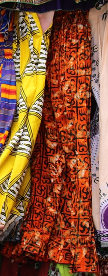Swastikas and other patterns on an orange cloth in Togo.