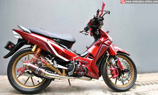 Foto Modifikasi Honda Supra Hanya tampilan pelek diganti pelek variasi warna gold merek Aplication untuk depan dan belakang agar menambah kesan elegan nalpot custom dengan model karbon warna merah Untuk jok, disesuaikan dengan nuansa racing looks.