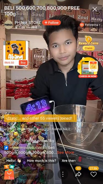 Khaled Hassan, also known as Abang Ah Ah, PHINIX STORE_s co-founder and livestream host conducting Shopee Live session