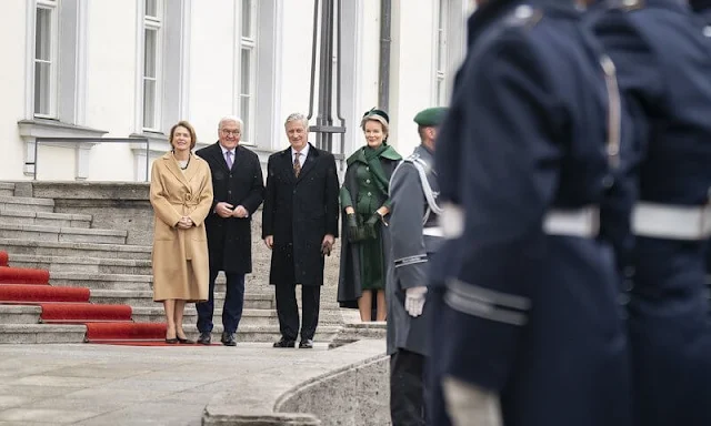 Queen Mathilde wore a camel embroidered coat by Esmeralda Ammoun, and green silk satin dress coat by Natan