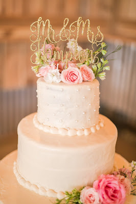 Rustic barn wedding meets vintage fairy tale. Meadow Creek Farm North Alabama Wedding Venue. Vintage Beauty and the Beast inspired wedding reception decoration ideas. Beautiful white wedding cake with pink roses, Mr. and Mrs. gold glitter wedding topper