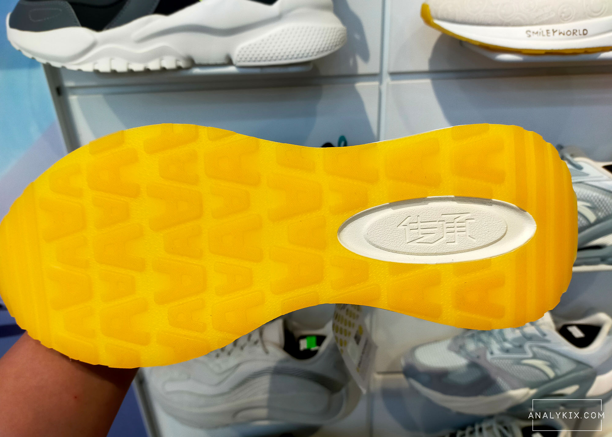 clear yellow outsole with letter A traction pattern