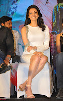 Beautiful Smiling Kajal Aggarwal in Creamy White Gown at MLA Telugu Movie Success Meet ~ .com Exclusive Pics 016.jpg