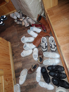 Everyone's shoes in a big pile