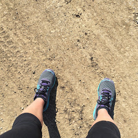 Running shoes on gravel road