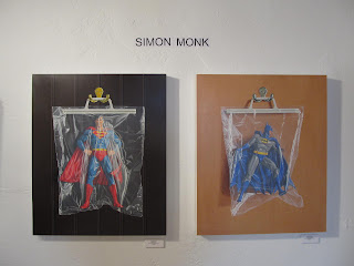 Simon Monk Superheros in bags at Aqua Art Fair, Miami 2012