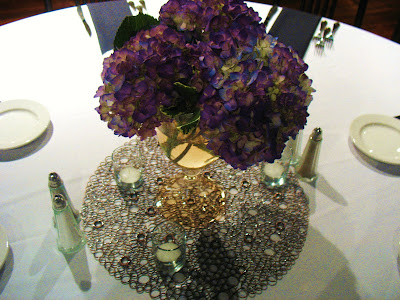 the bride 39s containers with a lush arrangements of purple hydrangea