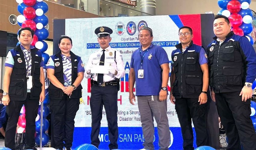 SG Hassan Pasco receives a Plaque of Recognition from CDRRMO