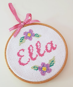 Baby name cross-stitch in an embroidery hoop