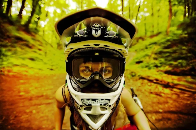 Girl in goggles and a off-road helmet