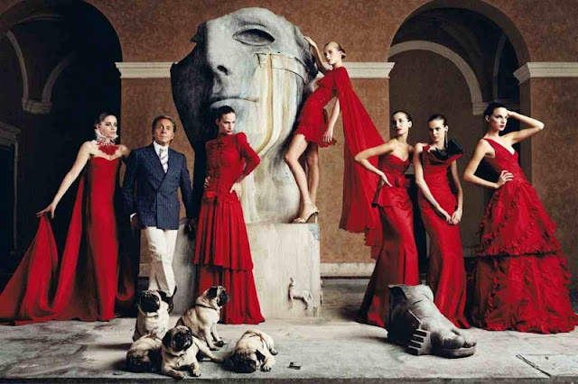 Valentino and models in red gown