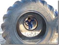 Nathaniel makes his way through the giant tires