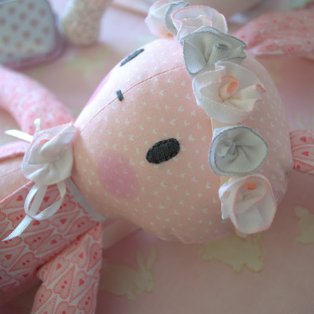 soft toy bunny with a halo of flowers