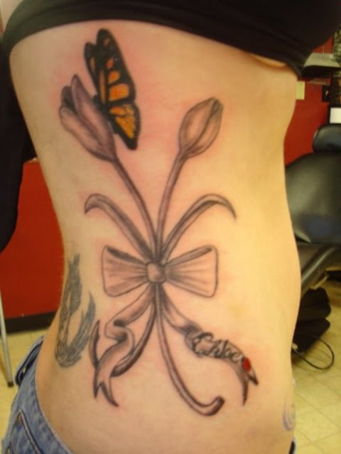 Flowers tattoo, tulip with butterfly tattoo for side piece tattoo designs