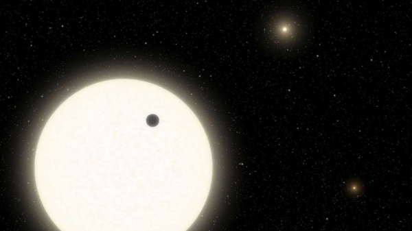 An artist's concept of the exoplanet KOI-5Ab orbiting its parent star in the KOI-5 system.