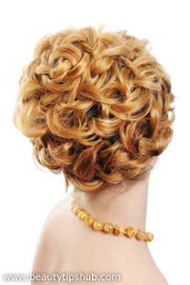 Lady with a creative hairstyle, blonde hairstyle, curly hairstyle, sport hairstyle