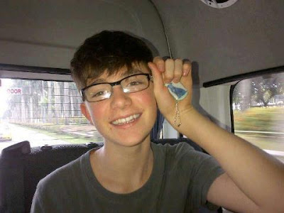 Greyson with his new glasses and a pic of Whiskey is puppy!