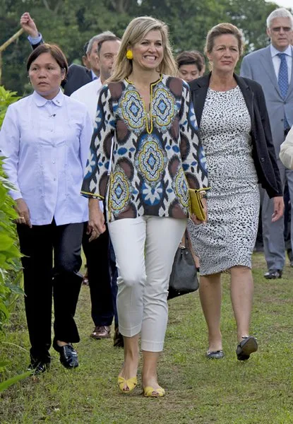 Filipino pineapple growers, during her visit at a Pineapple farm in Tagaytay City, south of Manila, Philippines