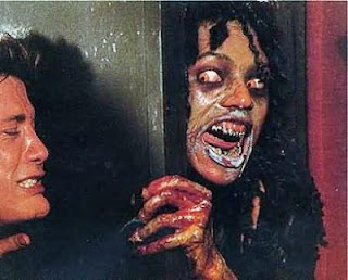 Geretta Geretta Demons Demoni Italian film 1985 Scary zombie vampire demon tries to break into room guy holds door. 