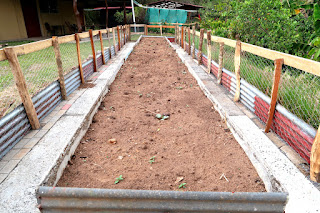 Raised garden bed made from concrete panels