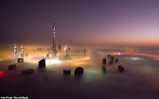 The city in the clouds: Dramatic images of Dubai's skyscrapers poking . (dubai )