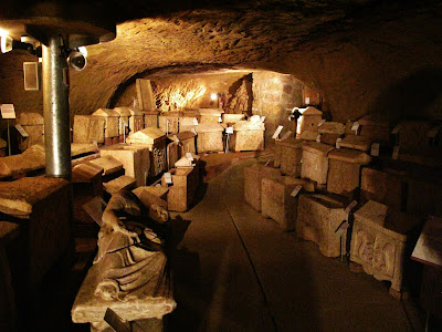 A room full of ancient ossuaries in Chiusi Underground Tour, Chiusi, Province of Siena, Tuscany, Italy