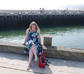 Girl in Dress Sat on Harbourside