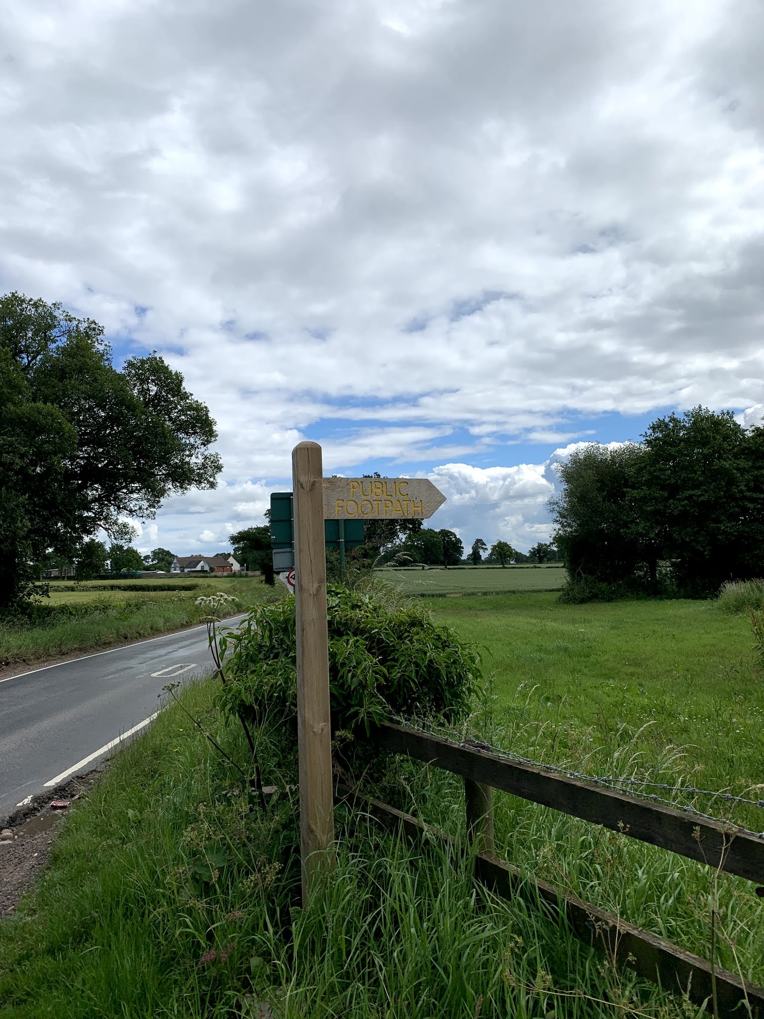 public footpath sign by road