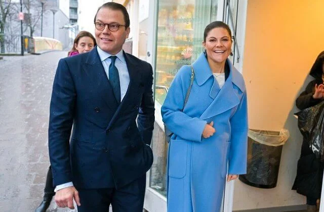 Crown Princess Victoria wore a Henriette sky blue wool coat by Andiata, and Ruma navy blazer suit by Tiger of Sweden