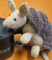 http://www.ravelry.com/patterns/library/don-the-dillo-knit-armadillo