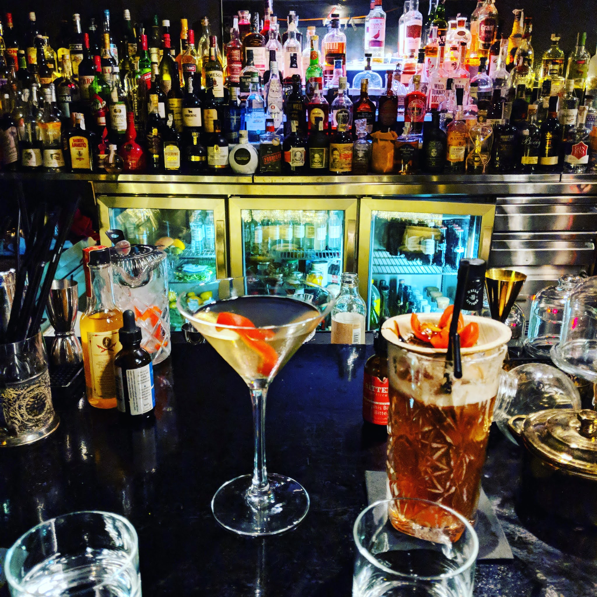 two cocktail glasses on the bar at Door 13 in palma de majorca