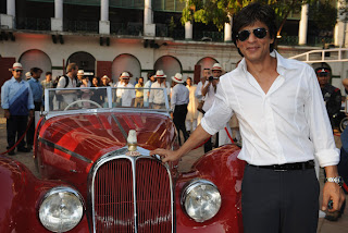 srk with a classic car