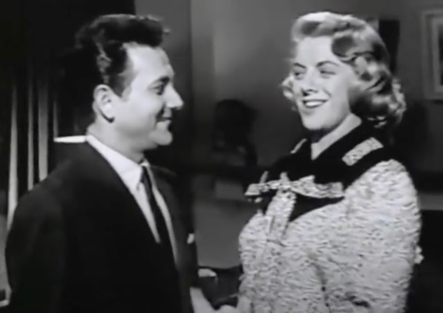 Screenshot of the Aug 7, 1956 episode of the Rosemary Clooney Show showing guest Joe Bushkin smiling at Clooney while they sing.
