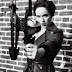 Christina Hendricks V Magazine Pics with Leather and Weapons
