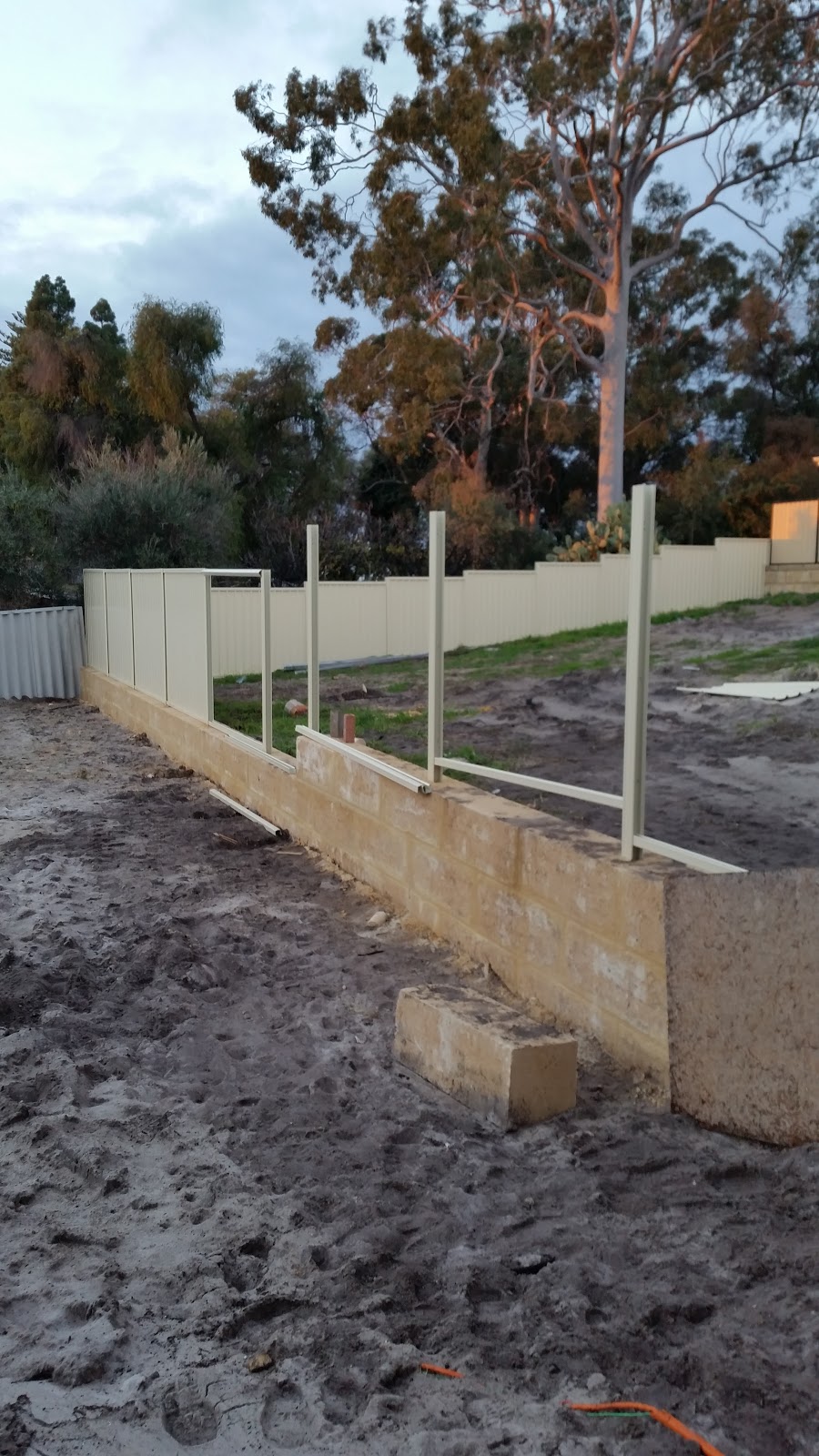 Jarrah Jungle New Limestone Retaining Wall + Colorbond Fence