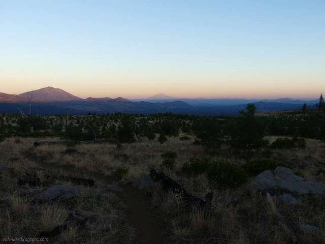 02: trail along flat with distant peaks lighted with sunlight while the bases are still in shadow