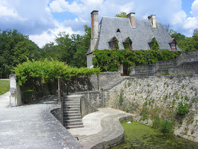 View of the estate manager's cottage from the quay at the Chateau of Chenonceau.  Indre et Loire, France. Photographed by Susan Walter. Tour the Loire Valley with a classic car and a private guide.