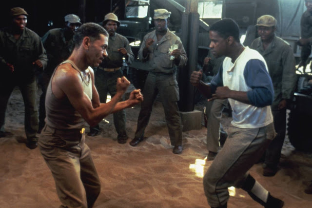 Adolph Caesar attempts to beat up Denzel for making him sit through Virtuosity.