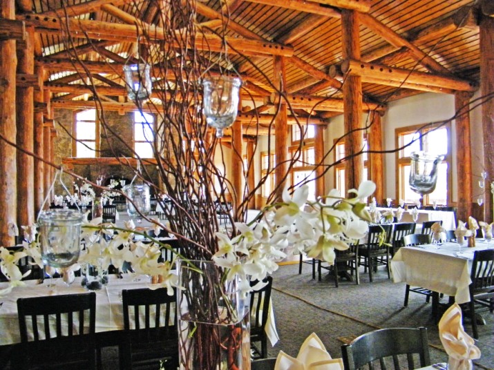 Centerpieces were alternating tall and short arrangements the taller ones