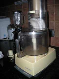 grating coconut in the Cuisinart, La Ceiba, Honduras