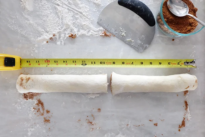 stretching dough log and cutting in half