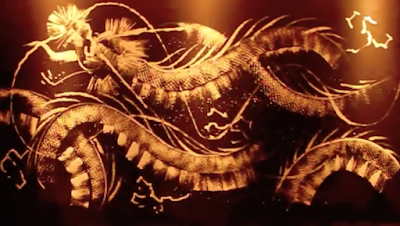 Video of the paining of a golden dragon by Takeshi Sato